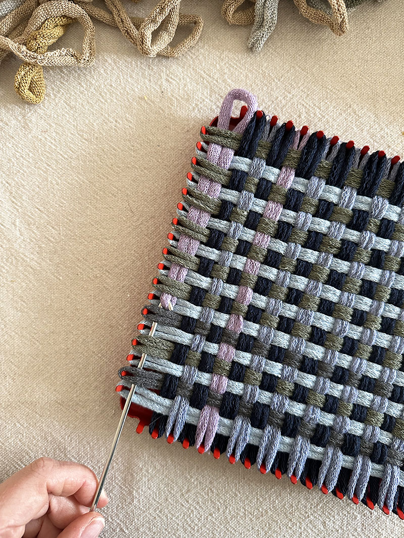 The last loop in a potholder weaving gets tricky and where using the weaving hook makes sense.
