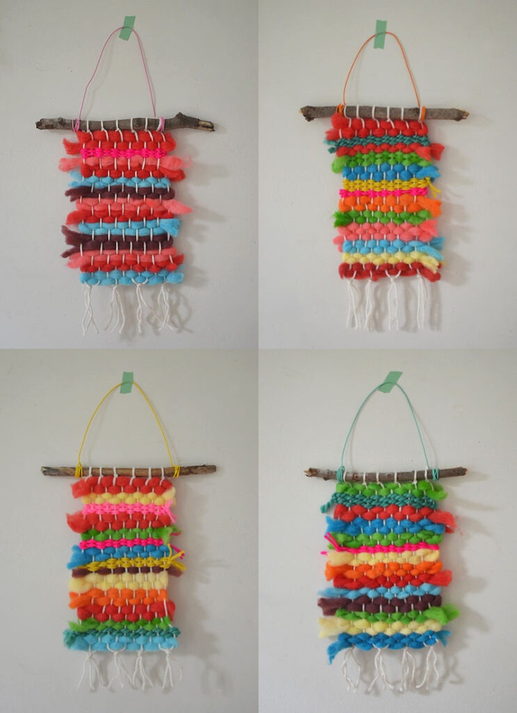 Weaving with a cardboard loom using rainbow-dyed wool roving.