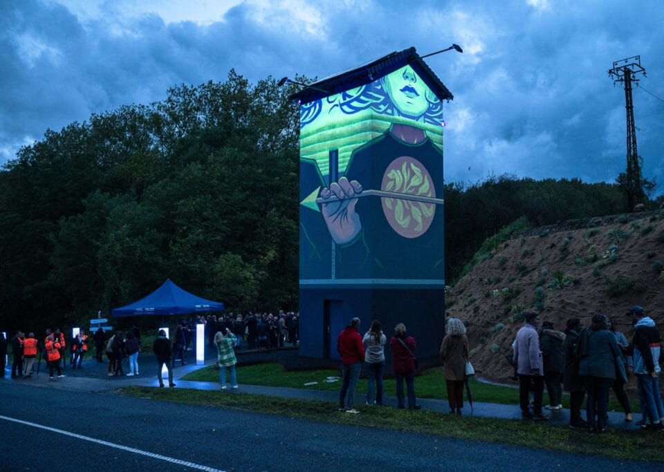 a glow-in-the-dark mural of a child holding an arrow