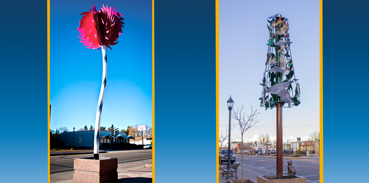 Two metal sculptures that resemble trees.