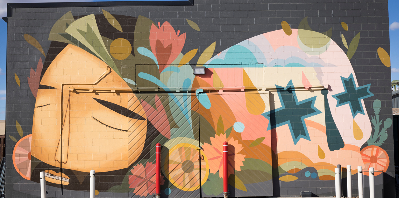 Colorful mural of a person lying down.